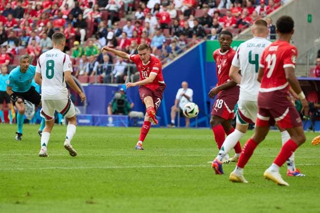 (240615) -- COLOGNE, June 15, 2024 -- Michel Aebischer (3rd L) of Switzerland shoots to score during the UEFA EURO, EM, Europameisterschaft,Fussball 2024 Group A match between Hungary and Switzerland in Cologne, Germany, June 15, 2024. ) (SP)GERMANY-COLOGNE-FOOTBALL-EURO 2024-SWITZERLAND VS HUNGARY MengxDingbo 