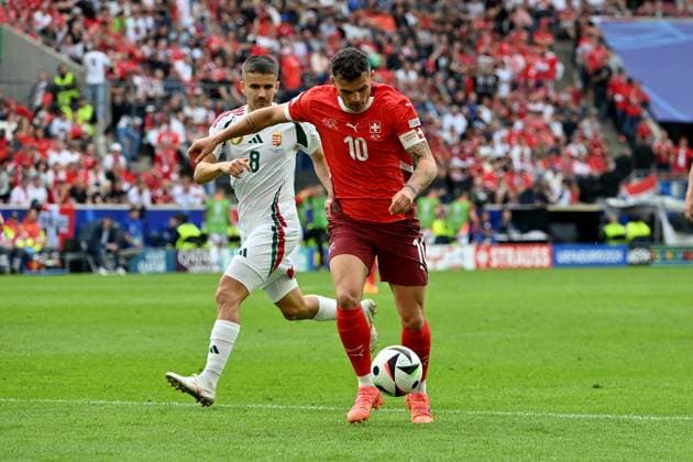 15.06.2024, xjrdrx, Fussball EM 2024, Ungarn - Schweiz emspor, v.l. Adam Nagy (Ungarn) Granit Xhaka (Schweiz) Zweikampf, Aktion, action, battle for the ball (DFL DFB REGULATIONS PROHIBIT ANY USE OF PHOTOGRAPHS as IMAGE SEQUENCES and or QUASI-VIDEO) Köln