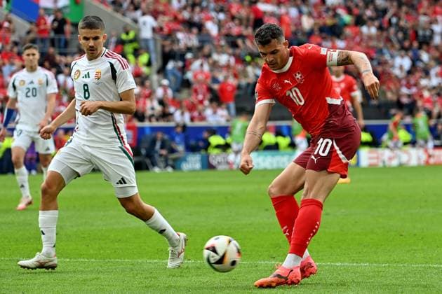 15.06.2024, xjrdrx, Fussball EM 2024, Ungarn - Schweiz emspor, v.l. Adam Nagy (Ungarn) Granit Xhaka (Schweiz) Zweikampf, Aktion, action, battle for the ball (DFL DFB REGULATIONS PROHIBIT ANY USE OF PHOTOGRAPHS as IMAGE SEQUENCES and or QUASI-VIDEO) Köln