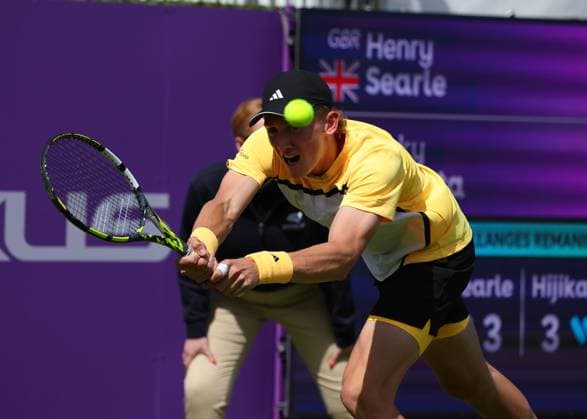 15th June 2024; Cinch Championships, Queens Club, West Kensington, London, England: Cinch Championships Queens Club, Qualifying Day 1; Henry Searle (GBR) with a backhand shot to Rinky Hijikata (AUS)  ActionPlus12654905 JohnxPatrickxFletcher