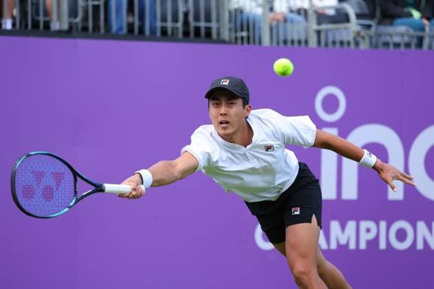 15th June 2024; Cinch Championships, Queens Club, West Kensington, London, England: Cinch Championships Queens Club, Qualifying Day 1; Rinky Hijikata (AUS) with a forehand shot to Henry Searle (GBR)  ActionPlus12654918 JohnxPatrickxFletcher