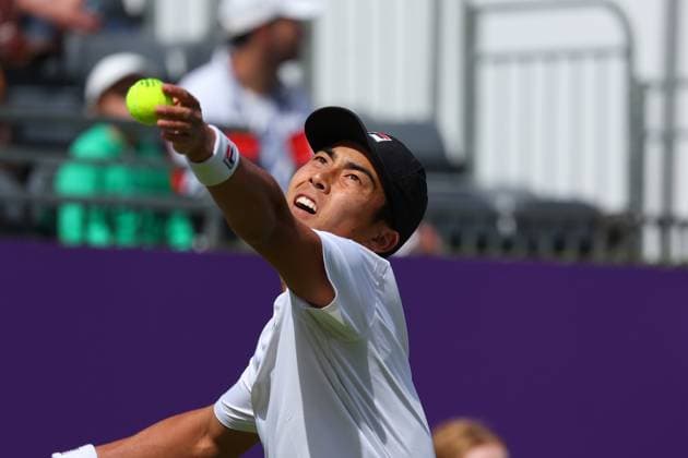 15th June 2024; Cinch Championships, Queens Club, West Kensington, London, England: Cinch Championships Queens Club, Qualifying Day 1; Rinky Hijikata (AUS) serves to Henry Searle (GBR)  ActionPlus12654921 JohnxPatrickxFletcher