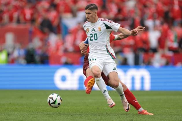 Cologne, Germany, 15th June 2024. Granit Xhaka of Switzerland tussles with Roland Sallai of Hungary during the UEFA European Championships match at Cologne Stadium, Cologne. Picture credit should read: Jonathan Moscrop Sportimage EDITORIAL USE ONLY. No use with unauthorised audio, video, data, fixture lists, club league logos or live services. Online in-match use limited to 120 images, no video emulation. No use in betting, games or single club league player publications. SPI-3181-0051