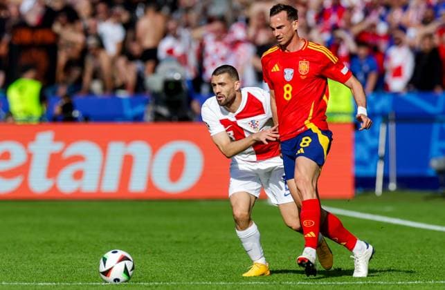 Spain v Croatia: Group B - UEFA EURO, EM, Europameisterschaft,Fussball 2024 BERLIN, GERMANY - JUNE 15: Mateo Kovacic of Croatia battles for possession with Fabian Ruiz of Spain during the UEFA EURO 2024 group stage match between Spain and Croatia at Olympiastadion on June 15, 2024 in Berlin, Germany. LukaxStanzl PIXSELL