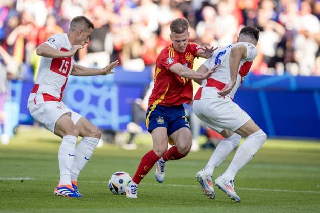 15th June 2024; Olympiastadion, Berlin, Germany; Euro 2024 Group B Football, Spain versus Croatia; Mario Pasalic (CRO), Dani Olmo (ESP) and Josip Sutalo (CRO) tussle for the ball  ActionPlus12654996 TomaszxJastrzebowski