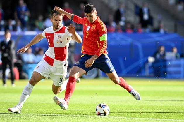 Spain v Croatia: Group B - UEFA EURO, EM, Europameisterschaft,Fussball 2024 BERLIN, GERMANY - JUNE 15: Alvaro Morata of Spain is challenged by Marin Pongracic of Croatia during the UEFA EURO 2024 group stage match between Spain and Croatia at Olympiastadion on June 15, 2024 in Berlin, Germany. MarkoxLukunic PIXSELL