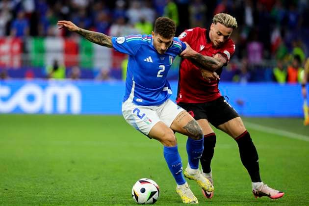Giovanni Di Lorenzo of Italy and Taulant Seferi of Albania compete for the ball during the Euro 2024 Group Stage B football match between Italy and Albania at BVB Stadium in Dortmund (Germany), June 15th, 2024. cesarexpurini
