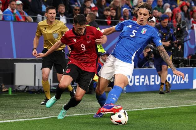 Dortmund, Germany, 15th June 2024. Riccardo Calafiori of Italy dispossesses Jasir Asani of Albania during the UEFA European Championships match at BVB Stadion, Dortmund. Picture credit should read: Jonathan Moscrop Sportimage EDITORIAL USE ONLY. No use with unauthorised audio, video, data, fixture lists, club league logos or live services. Online in-match use limited to 120 images, no video emulation. No use in betting, games or single club league player publications. SPI-3182-0012