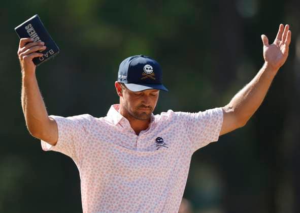 Bryson DeChambeau fires up fans on the ninth green during the third round of the 124th U.S. Open golf championship at Pinehurst Resort & Country Club in Pinehurst, N.C. on Saturday, June 15, 2024.  NCP20240615334 JOHNxANGELILLO