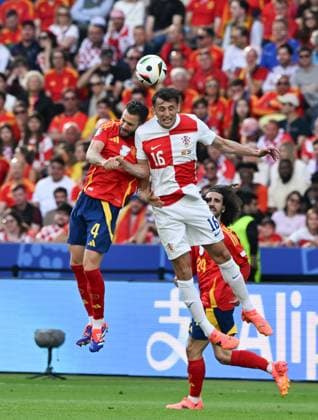 (240616) -- BERLIN, June 16, 2024 -- Nacho Fernandez (top L) of Spain vies with Ante Budimir (top R) of Croatia during the UEFA EURO, EM, Europameisterschaft,Fussball 2024 Group B match between Spain and Croatia in Berlin, Germany on June 15, 2024. ) (SP)GERMANY-BERLIN-FOOTBALL-EURO 2024-SPAIN VS CROATIA RenxPengfei 