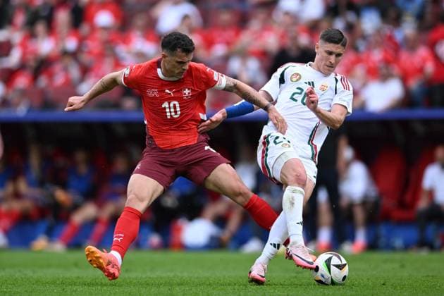 Roland Sallai (Hungary)Granit Xhaka (Switzerland) during the UEFA EURO, EM, Europameisterschaft,Fussball Germany 2024 match between Hungary 1-3 Switzerland at Cologne Stadium on June 15, 2024 in Cologne, Germany. Noxthirdxpartyxsales  (256543209)