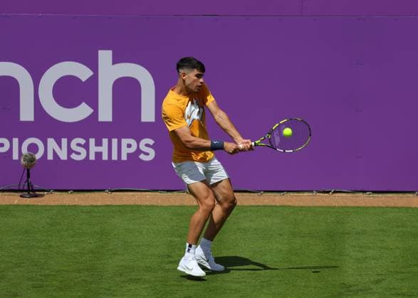 16th June 2024; Cinch Championships, Queens Club, West Kensington, London, England: Cinch Championships Queens Club, Qualifying Day 2; Defending Cinch Champion Carlos Alcaraz (ESP) with a backhand shot to Francisco Cerundolo (ARG) during his practice session on Centre Court  ActionPlus12655100 JohnxPatrickxFletcher