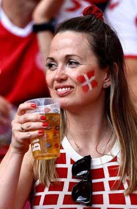 A danish fan wearing face paint holds a drink in the stadium ahead of the game Slovenia v Denmark, UEFA European Championship, EM, Europameisterschaft 2024, Group C, Football, Stuttgart Arena, Stuttgart, Germany, 16 Jun 2024 EDITORIAL USE ONLY No use with unauthorised audio, video, data, fixture lists, club league logos or live services. Online in-match use limited to 120 images, no video emulation. No use in betting, games or single club league player publications. Copyright: xMichaelxZemanek Shutterstockx 14539399ad