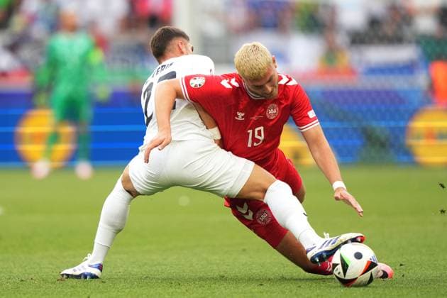 Denmark s Jonas Wind fight for the ball with Slovenia s Adam Gnezda Cerin during the Euro 2024 soccer match between Slovenia and Denmark at the Stuttgart Arena , Stuttgart , Germany - Sunday 16 , June , 2024. - Soccer .  Copyright: xSpada LaPressex