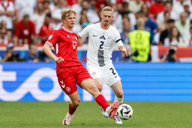 16.06.2024, Fussball, Europameisterschaft, Slovenia - Denmark, GER, Stuttgart, Football Arena, Bild: v. li. Victor Kristiansen (Denmark, 17), Zan Karnicnik (Slovenia, 2), Action, duels, fighting for the ball, Copyright: HMBxMedia xHeikoxBecker