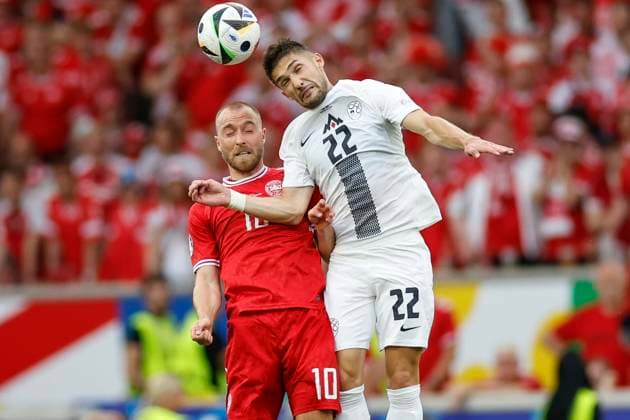 16.06.2024, Fussball, Europameisterschaft, Slovenia - Denmark, GER, Stuttgart, Football Arena, Bild: v. li. Christian Eriksen (Denmark, 10) Adam Gnezda Cerin (Slovenia, 22), Action, duels, fighting for the ball, head, Copyright: HMBxMedia xHeikoxBecker