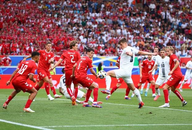 Andreas Christensen and Joachim Andersen of Denmark look on as Jaka Bijol of Slovenia untunefully stretches to the ball Slovenia v Denmark, UEFA European Championship, EM, Europameisterschaft 2024, Group C, Football, Stuttgart Arena, Stuttgart, Germany, 16 Jun 2024 EDITORIAL USE ONLY No use with unauthorised audio, video, data, fixture lists, club league logos or live services. Online in-match use limited to 120 images, no video emulation. No use in betting, games or single club league player publications. Copyright: xMichaelxZemanek Shutterstockx 14539399gd