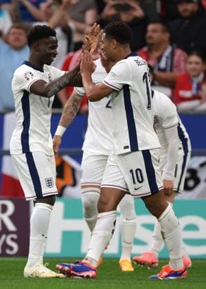 Gelsenkirchen, Germany, 16th June 2024. Jude Bellingham of England celebrates with team mates after scoring to give the side a 1-0 lead during the UEFA European Championships match at Arena Aufschalke, Gelsenkirchen. Picture credit should read: Jonathan Moscrop Sportimage EDITORIAL USE ONLY. No use with unauthorised audio, video, data, fixture lists, club league logos or live services. Online in-match use limited to 120 images, no video emulation. No use in betting, games or single club league player publications. SPI-3183-0021