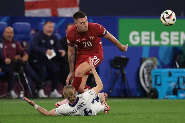 Gelsenkirchen, Germany, 16th June 2024. Sergej Milinkovic-Savic of Serbia clashes with Conor Gallagher of England during the UEFA European Championships match at Arena Aufschalke, Gelsenkirchen. Picture credit should read: Jonathan Moscrop Sportimage EDITORIAL USE ONLY. No use with unauthorised audio, video, data, fixture lists, club league logos or live services. Online in-match use limited to 120 images, no video emulation. No use in betting, games or single club league player publications. SPI-3183-0041