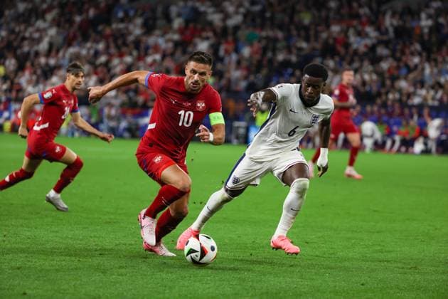 (240617) -- GELSENKIRCHEN, June 17, 2024 -- Dusan Tadic (L) of Serbia vies with Marc Guehi of England during the UEFA EURO, EM, Europameisterschaft,Fussball 2024 Group C match between England and Serbia in Gelsenkirchen, Germany on June 16, 2024. ) (SP)GERMANY-GELSENKIRCHEN-FOOTBALL-EURO 2024-ENGLAND VS SERBIA ZhangxFan 