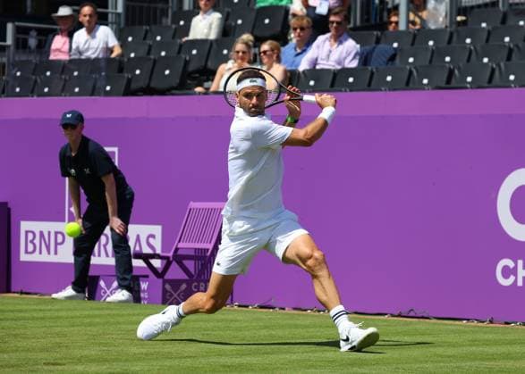 17th June 2024; Cinch Championships, Queens Club, West Kensington, London, England: Cinch Championships Queens Club, Day 1; Grigor Dimitrov (BUL) with a backhand shot to Adrian Mannarino (FRA) mens singles  ActionPlus12655625 JohnxPatrickxFletcher