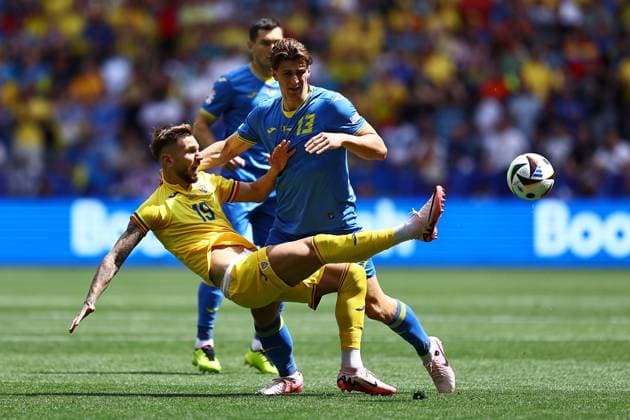 Denis Dragus of Romania and Illya Zabarnyi of Ukraine Romania v Ukraine, UEFA European Championship, EM, Europameisterschaft 2024, Group E, Football, Munich Football Arena, Munich, Germany, 17 Jun 2024 EDITORIAL USE ONLY No use with unauthorised audio, video, data, fixture lists, club league logos or live services. Online in-match use limited to 120 images, no video emulation. No use in betting, games or single club league player publications. Copyright: xMichaelxZemanek Shutterstockx 14539636n