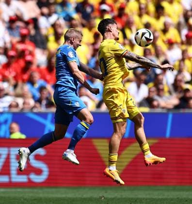 Oleksandr Zinchenko of Ukraine, Dennis Man of Romania Romania v Ukraine, UEFA European Championship, EM, Europameisterschaft 2024, Group E, Football, Munich Football Arena, Munich, Germany, 17 Jun 2024 EDITORIAL USE ONLY No use with unauthorised audio, video, data, fixture lists, club league logos or live services. Online in-match use limited to 120 images, no video emulation. No use in betting, games or single club league player publications. Copyright: xMichaelxZemanek Shutterstockx 14539636r