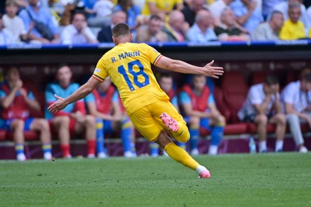 Bild zeigt: Torjubel Rumänien, R. Marin (18, Rumänien), 17.06.2024, München, Fussball, Europameisterschaft, Rumänien - Ukraine, EVENT REGULATIONS PROHIBIT ANY USE OF PHOTOGRAPHS AS IMAGE SEQUENCES AND OR QUASI-VIDEO.