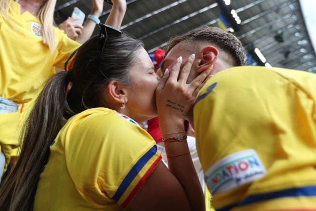 Denis Dragus of Romania kisses his wife after the match Romania v Ukraine, UEFA European Championship, EM, Europameisterschaft 2024, Group E, Football, Munich Football Arena, Munich, Germany, 17 Jun 2024 EDITORIAL USE ONLY No use with unauthorised audio, video, data, fixture lists, club league logos or live services. Online in-match use limited to 120 images, no video emulation. No use in betting, games or single club league player publications. Copyright: xMichaelxZemanek Shutterstockx 14539636bo