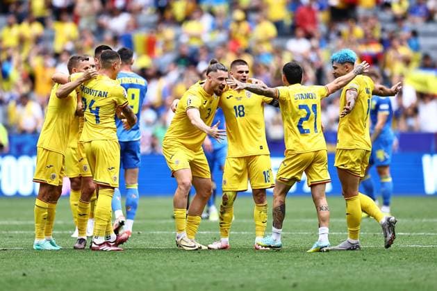 Romania players celebrate Romania v Ukraine, UEFA European Championship, EM, Europameisterschaft 2024, Group E, Football, Munich Football Arena, Munich, Germany, 17 Jun 2024 EDITORIAL USE ONLY No use with unauthorised audio, video, data, fixture lists, club league logos or live services. Online in-match use limited to 120 images, no video emulation. No use in betting, games or single club league player publications. Copyright: xMichaelxZemanek Shutterstockx 14539636by