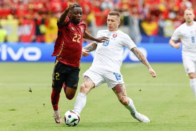 FRANKFURT, Arena Frankfurt, 17-06-2024 , European Football Championship Euro2024, Group stage match no.9 between Belgium and Slovakia. Belgium player Jeremy Doku and Slovakia player Juraj Kucka Belguim - Slovakia (Euro2024)  x25517698x Copyright: