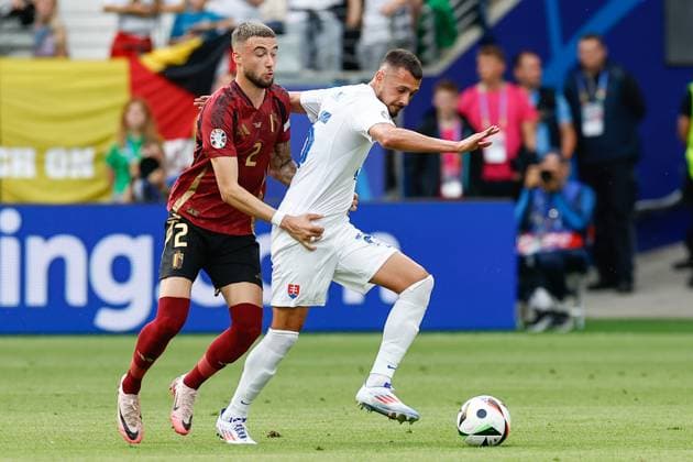FRANKFURT, Arena Frankfurt, 17-06-2024 , European Football Championship Euro2024, Group stage match no.9 between Belgium and Slovakia. Belgium player Zeno Debast and Slovakia player Ivan Schranz Belguim - Slovakia (Euro2024)  x25517928x Copyright: