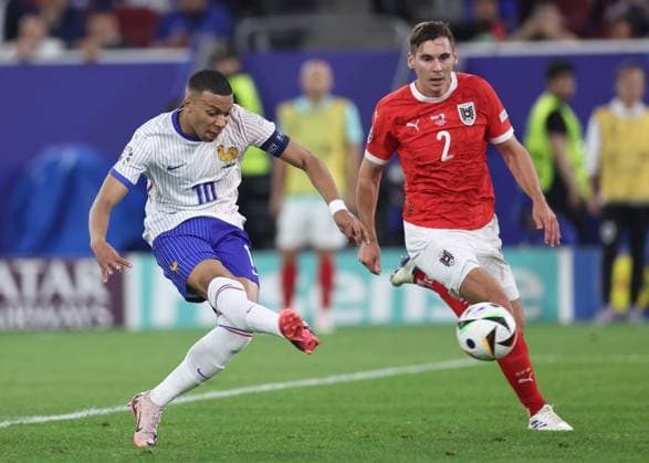 Dusseldorf, Germany, 17th June 2024. Kylan Mbappe of France shoots during the UEFA European Championships match at Dusseldorf Arena, Dusseldorf. Picture credit should read: David Klein Sportimage EDITORIAL USE ONLY. No use with unauthorised audio, video, data, fixture lists, club league logos or live services. Online in-match use limited to 120 images, no video emulation. No use in betting, games or single club league player publications. SPI-3197-0065
