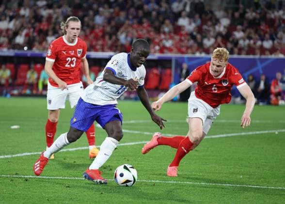 Dusseldorf, Germany, 17th June 2024. N Golo Kante of France attempts go round Nicolas Seiwald of Austria during the UEFA European Championships match at Dusseldorf Arena, Dusseldorf. Picture credit should read: David Klein Sportimage EDITORIAL USE ONLY. No use with unauthorised audio, video, data, fixture lists, club league logos or live services. Online in-match use limited to 120 images, no video emulation. No use in betting, games or single club league player publications. SPI-3197-0072