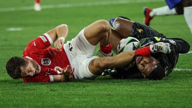 (240618) -- DUSSELDORF, June 18, 2024 -- Christoph Baumgartner (L) of Austria and Mike Maignan of France fall down after a clash during the UEFA EURO, EM, Europameisterschaft,Fussball 2024 Group D match between Austria and France in Dusseldorf, Germany, on June 17, 2024. ) (SP)GERMANY-DUSSELDORF-FOOTBALL-EURO 2024-AUSTRIA VS FRANCE PanxYulong 