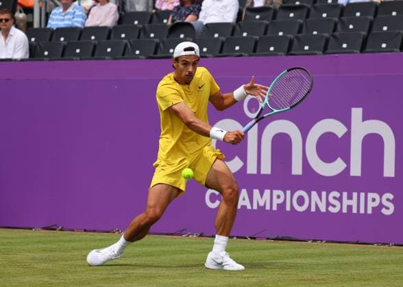 18th June 2024; Cinch Championships, Queens Club, West Kensington, London, England: Cinch Championships Queens Club, Day 2; Lorenzo MUSETTI (ITA) with a backhand shot to Alex DE MINAUR (AUS), mens singles match  ActionPlus12656205 JohnxPatrickxFletcher