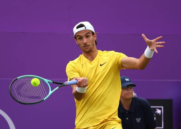 18th June 2024; Cinch Championships, Queens Club, West Kensington, London, England: Cinch Championships Queens Club, Day 2; Lorenzo MUSETTI (ITA) with a forehand shot to Alex DE MINAUR (AUS), mens singles match  ActionPlus12656207 JohnxPatrickxFletcher