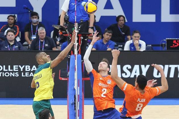 PH: Brazil Outlasts Netherlands in Four Sets during VNL 2024 Match Ricardo Lucarelli Souza 18, Yellow of Brasil drops the ball over Wessel Keemink 2, Orange and Fabian Plak 8, Orange of the Netherlands. Pasay City Metro Manila Philippines Copyright: DennisxJeromexAcosta
