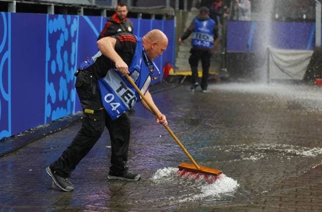Groundstaff sweep away a flooded area after heavy rain Turkiye v Georgia, UEFA European Championship, EM, Europameisterschaft 2024, Group F, Football, BVB Stadion, Dortmund, Germany, 18 Jun 2024 EDITORIAL USE ONLY No use with unauthorised audio, video, data, fixture lists, club league logos or live services. Online in-match use limited to 120 images, no video emulation. No use in betting, games or single club league player publications.  Copyright: xPaulxCurrie Shutterstockx 14543470ag