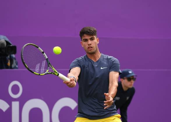 18th June 2024; Cinch Championships, Queens Club, West Kensington, London, England: Cinch Championships Queens Club, Day 2; Carlos Alcaraz (ESP) with a backhand shot to Francisco Cerundolo (ARG), mens singles match  ActionPlus12656358 JohnxPatrickxFletcher