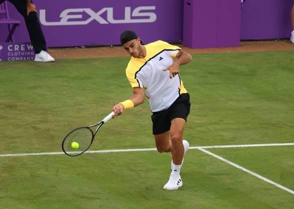 18th June 2024; Cinch Championships, Queens Club, West Kensington, London, England: Cinch Championships Queens Club, Day 2; Francisco Cerundolo (ARG) with a forehand shot to Carlos Alcaraz (ESP), mens singles match  ActionPlus12656670 JohnxPatrickxFletcher
