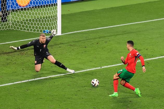 Football - UEFA EURO, EM, Europameisterschaft,Fussball 2024 - Group F - Portugal v Czech Republic 18th June 2024 - UEFA EURO 2024 - Group F - Portugal v Czech Republic - Czech Republic goalkeeper Jindrich Stanek saves a shot from Cristiano Ronaldo of Portugal - Photo: Simon Stacpoole Offside. Leipzig Germany Copyright: xSimonxStacpoolexOffside