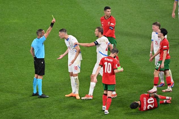 Czech Patrik Schick (2nd left) receives yellow card from referee during the Czech Republic vs. Portugal match within the European Football Championships, Leipzig, Germany, June 18, 2024. (CTKxPhoto OndrejxHajek) CTKPhotoP2024061809217  CTKPhotoP2024061809217