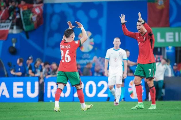 EURO 2024 - Matchday 1, Group F: Portugal vs. Czech Republic Cristiano Ronaldo shares the joy of Portugal winning three points with youngster Francisco Conceicao after the EURO 2024 Day 1, Group F match between Portugal and Czech Republic on 18 June 2024, at Red Bull Arena, in Leipzig, Germany Leipzig Red Bull Arena Germany Copyright: xAlexandraxFechetex DSC06364