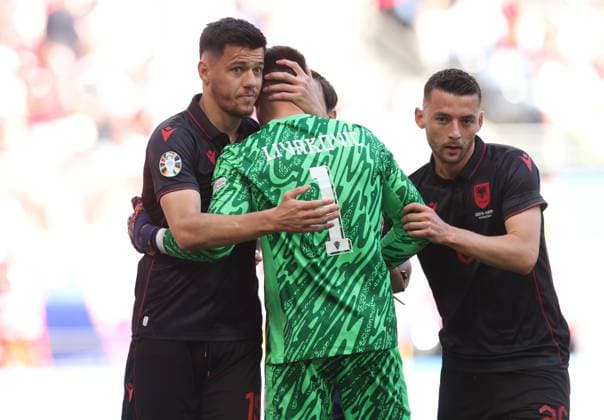 Dominik Livakovic of Croatia is hugged by Albania players Croatia v Albania, UEFA European Championship, EM, Europameisterschaft 2024, Group B, Football, Volksparkstadion, Hamburg, Germany, 19 Jun 2024 EDITORIAL USE ONLY No use with unauthorised audio, video, data, fixture lists, club league logos or live services. Online in-match use limited to 120 images, no video emulation. No use in betting, games or single club league player publications. Copyright: xPaulxCurrie Shutterstockx 14543648da