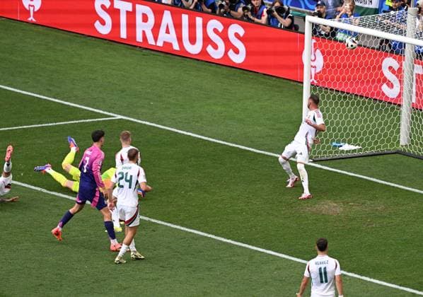 19.06.2024, xjhx, Fussball EM 2024, Deutschland - Ungarn emspor, v.l. Jamal Musiala (Deutsche Fussball Nationalmannschaft DFB), Peter Gulacsi (Ungarn) Goal scored, erziehlt das Tor zum 1:0 (UEFA REGULATIONS PROHIBIT ANY USE OF PHOTOGRAPHS as IMAGE SEQUENCES and or QUASI-VIDEO) Stuttgart