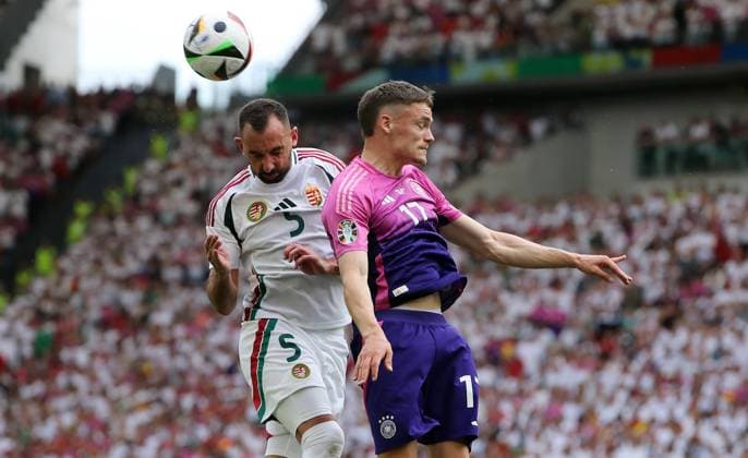 Attila Fiola im Zweikampf mit Florian Wirtz Fußball Fussball Europameisterschaft Euro 2024 EM Herren Saison 2023 2024 19.06.2024 Deutschland GER vs. Ungarn HUN in Stuttgart DFL regulations prohibit any use of photographs as image sequences and or quasi-video.
