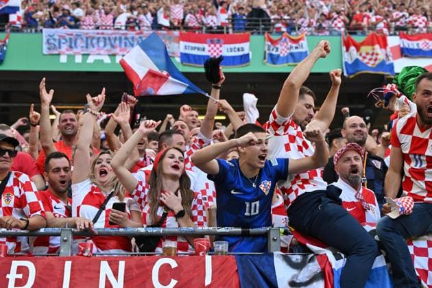(240619) -- HAMBURG, June 19, 2024 -- Fans of Croatia celebrate during the UEFA EURO, EM, Europameisterschaft,Fussball 2024 Group B match between Croatia and Albania in Hamburg, Germany on June 19, 2024. ) (SP)GERMANY-HAMBURG-FOOTBALL-EURO 2024-CROATIA VS ALBANIA RenxPengfei 