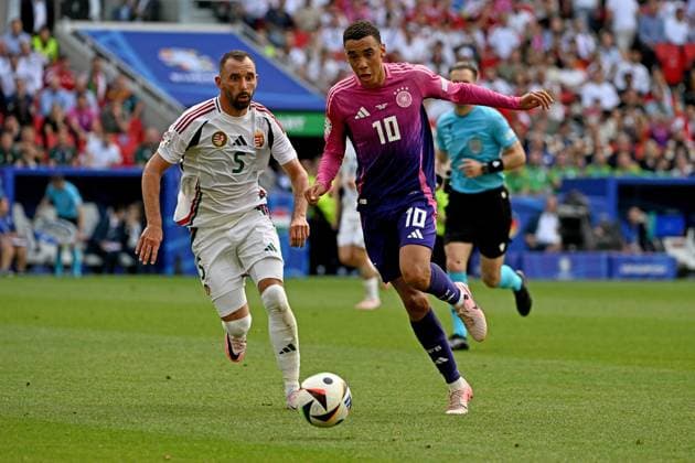 19.06.2024, xpsx, Fussball EM 2024, Deutschland - Ungarn emspor, v.l. Attila Fiola (Ungarn) Jamal Musiala (Deutsche Fussball Nationalmannschaft DFB) Zweikampf, Aktion, action, battle for the ball (DFL DFB REGULATIONS PROHIBIT ANY USE OF PHOTOGRAPHS as IMAGE SEQUENCES and or QUASI-VIDEO) Stuttgart
