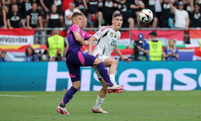 Joshua Kimmich im Zweikampf mit Roland Sallai Fußball Fussball Europameisterschaft Euro 2024 EM Herren Saison 2023 2024 19.06.2024 Deutschland GER vs. Ungarn HUN in Stuttgart DFL regulations prohibit any use of photographs as image sequences and or quasi-video.